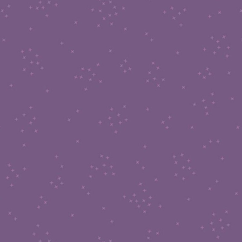 This heather purple fabric is scattered with tiny tonal crosses clustered together.