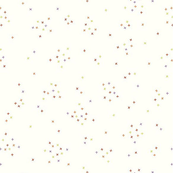 This white fabric is scattered with tiny green, purple, and red crosses clustered together.