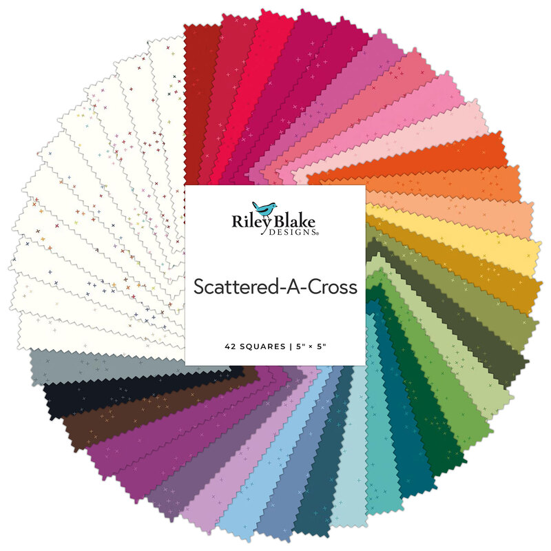 A spiral fabric collage featuring a rainbow of colors from the Scattered-A-Cross collection.