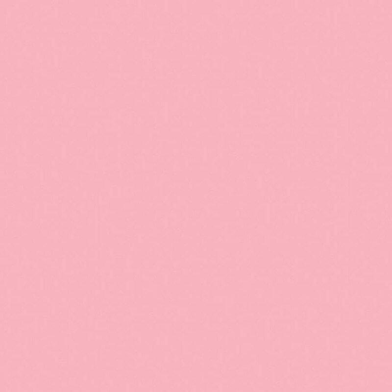 This solid flannel fabric features a soft pink color. 