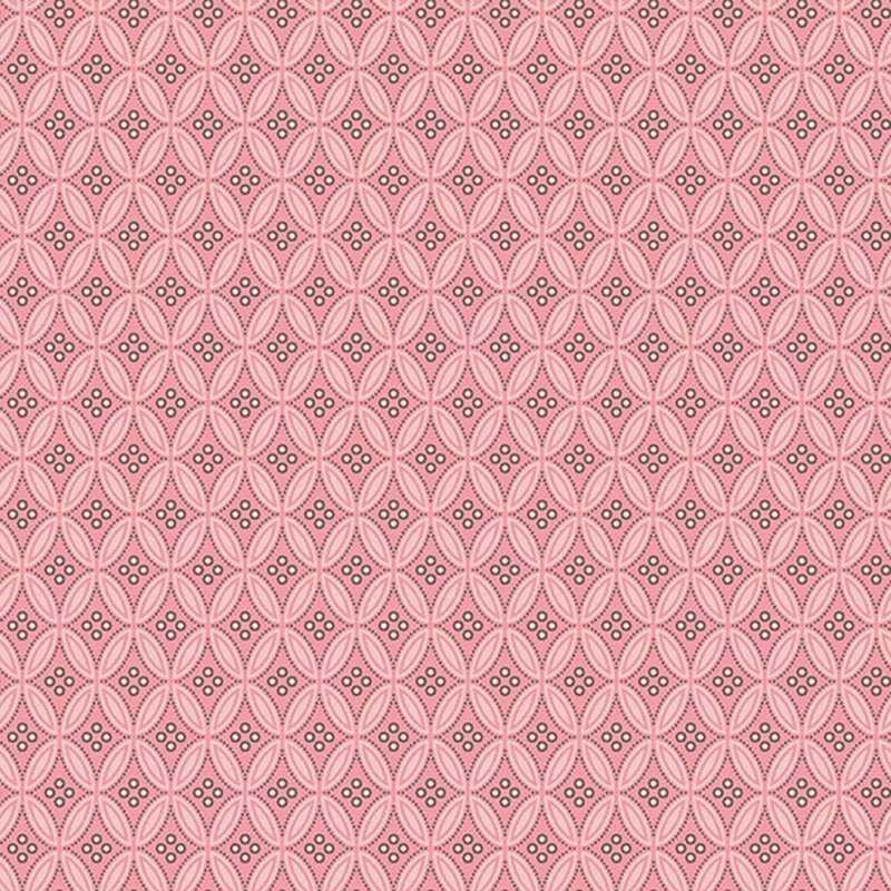 Blush pink fabric with a pattern of retro diamond shapes with small circles
