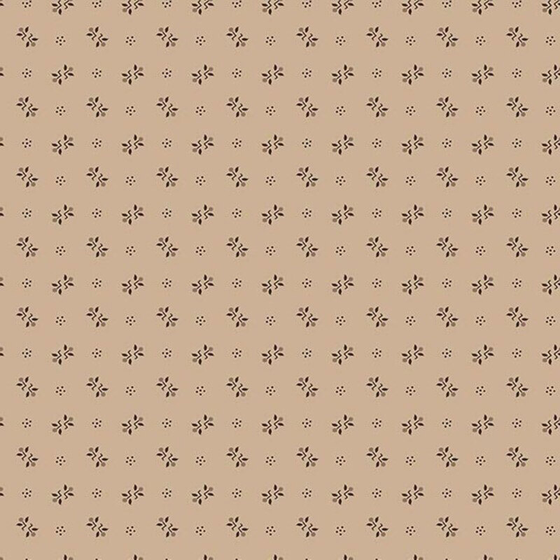 Latte brown fabric with a ditsy pattern of primitive brown motifs