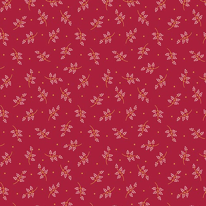 Cherry red fabric with tossed leafy stems in cream