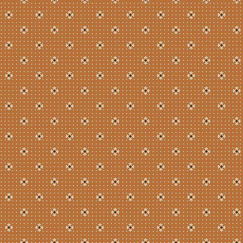 Dark gold fabric with cream dots and primitive cream and black motifs.