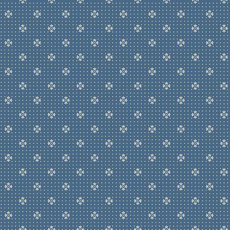 Denim blue fabric with cream dots and primitive light blue motifs