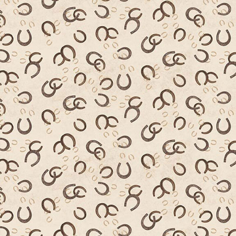 Tossed pattern of brown horseshoes on a cream background