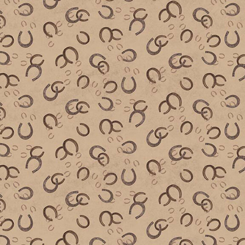Tossed pattern of brown horseshoes on a warm tan background