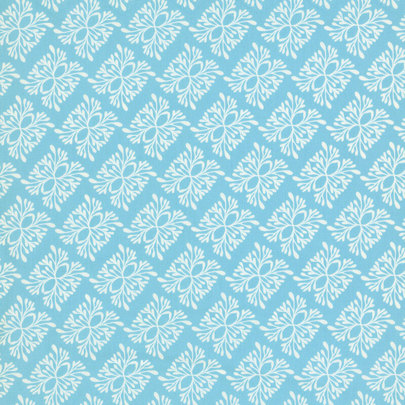 A light blue fabric with a repeating pattern of stylized motifs in white.
