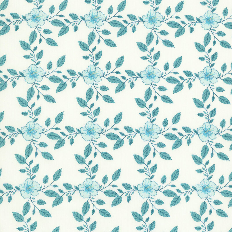 Soft ivory fabric featuring a repeating pattern of light blue hibiscus flowers and teal leaves with stems.