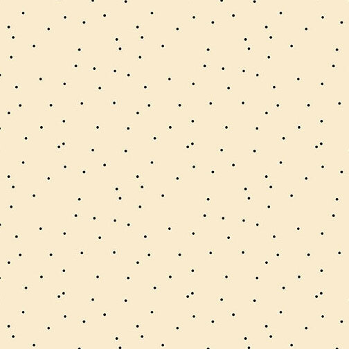 Cream fabric featuring a scattered black polka dot print.