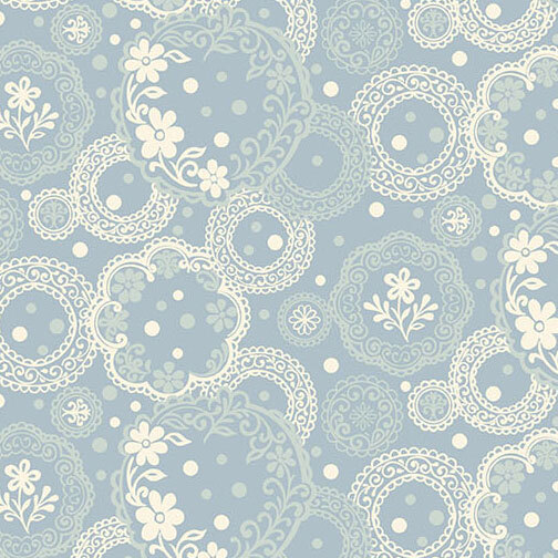 Ornate pattern of pale aqua and ivory circular medallions filled with lace-like details, florals, and dotted accents on a pale blue background.