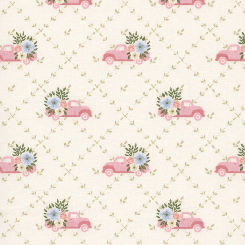 A soft cream fabric with a green floral lattice pattern featuring pink vintage trucks with floral bouquets in the back.
