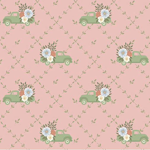 A blush fabric with a green floral lattice pattern featuring green vintage trucks with floral bouquets in the back.