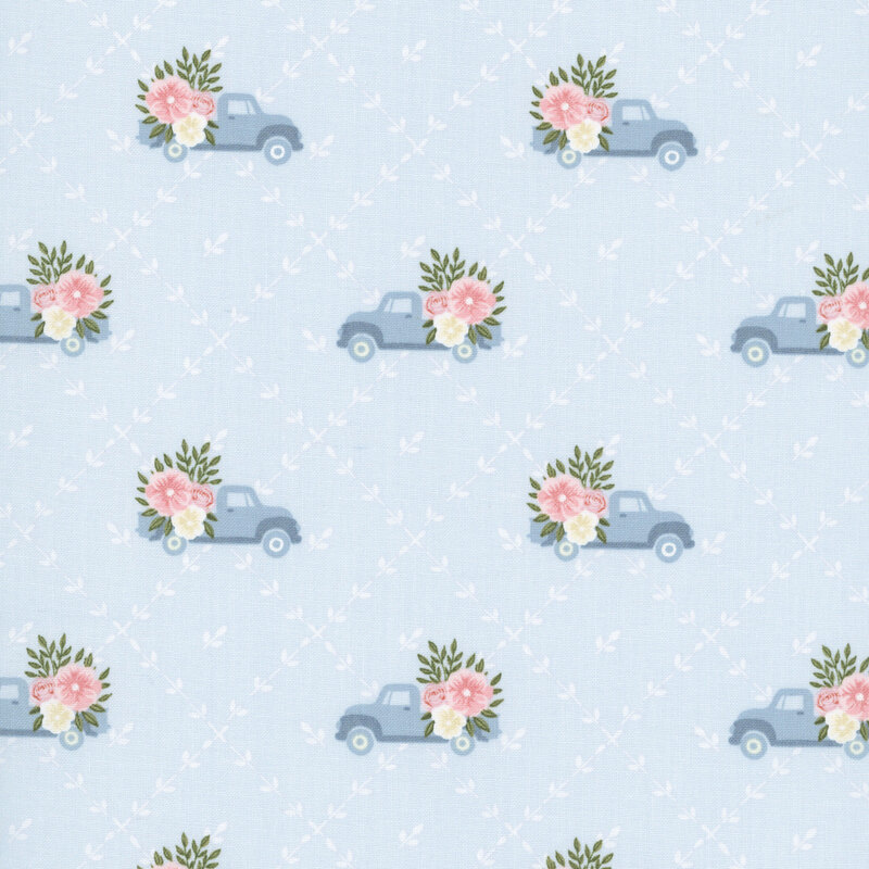 A pale blue fabric with a white floral lattice pattern featuring blue vintage trucks with floral bouquets in the back.