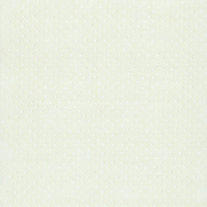 Textured, light taupe fabric with a rustic pattern of white dots