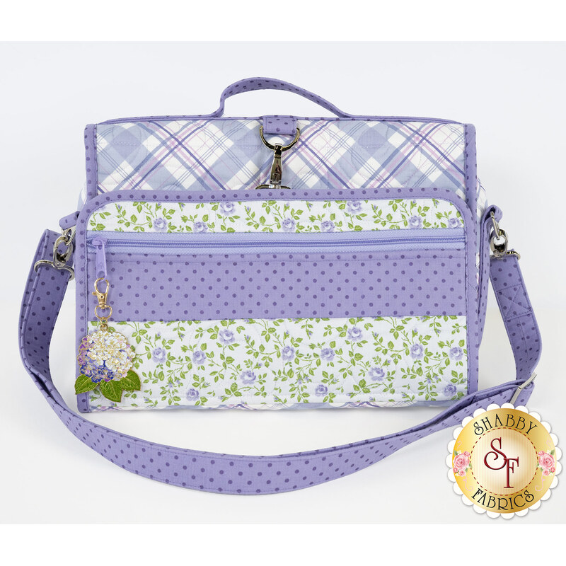 The travel bag folded up, isolated on a white background. 