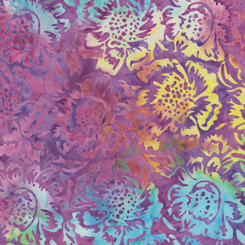 A mottled passion purple batik fabric with large yellow and teal flowers. 