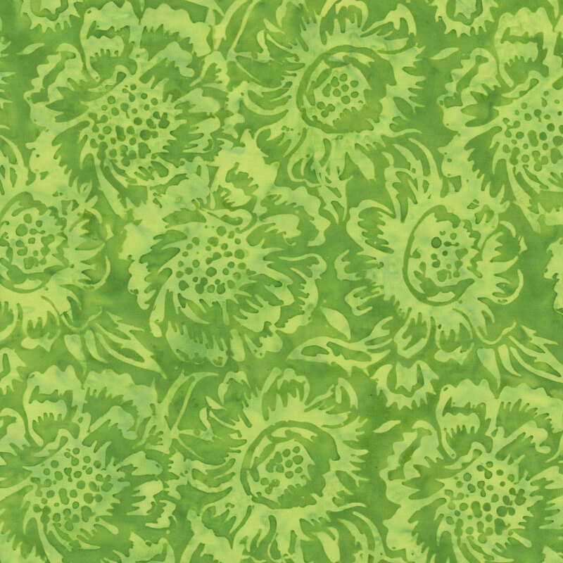 A mottled lime green batik fabric with large tonal flowers. 