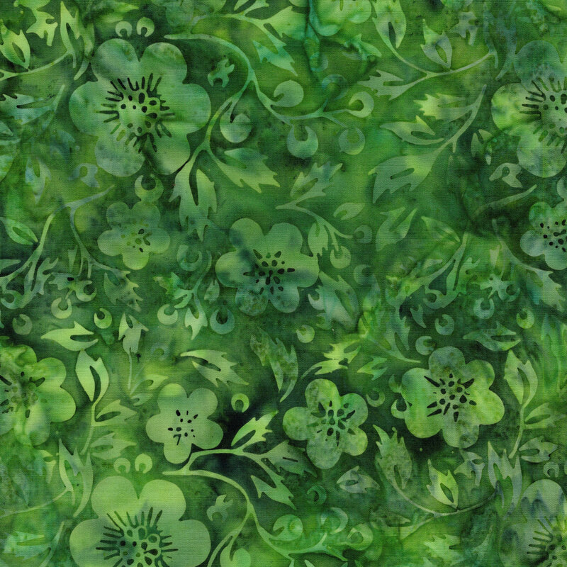 A mottled lime green batik fabric with tonal flowers and vines. 
