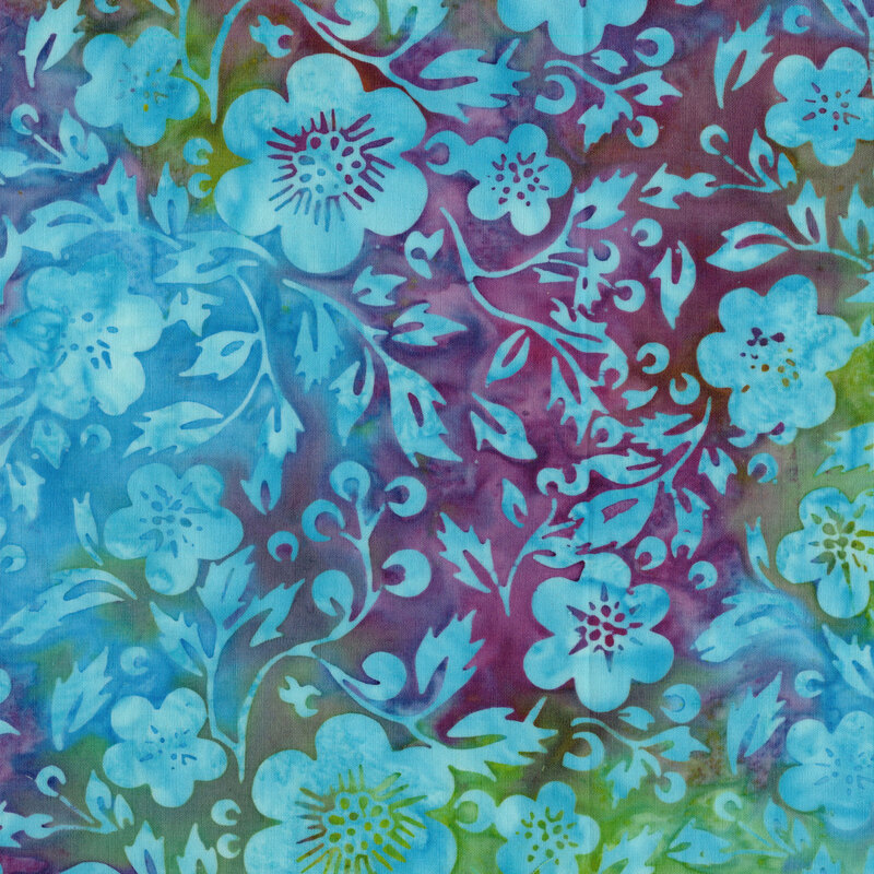 A mottled lime green and magenta batik fabric with ocean blue flowers and vines. 