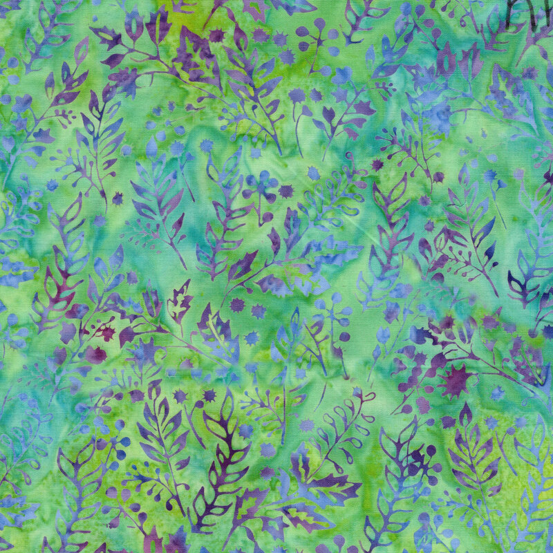A mottled lime green and ocean blue batik fabric with violet leaves and berries. 