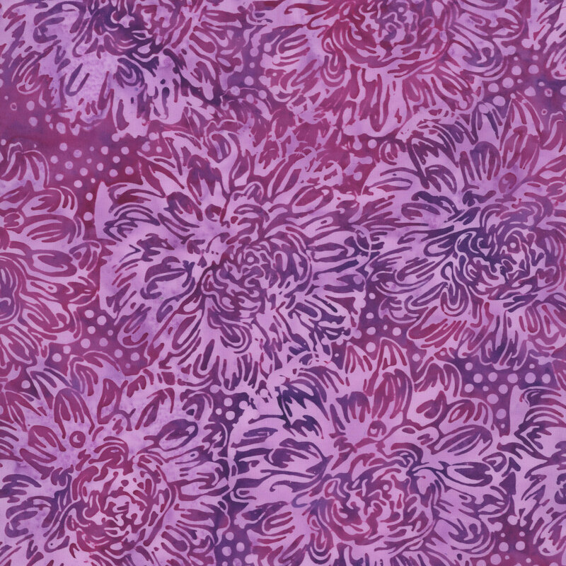 A deep magenta batik fabric with large pink dahlias. 