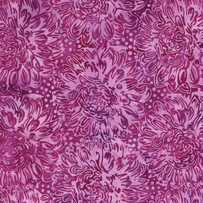 A magenta batik fabric with large pink dahlias. 