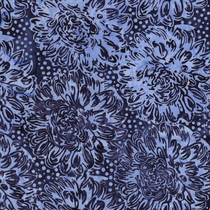 A indigo blue batik fabric with large blue dahlias. 