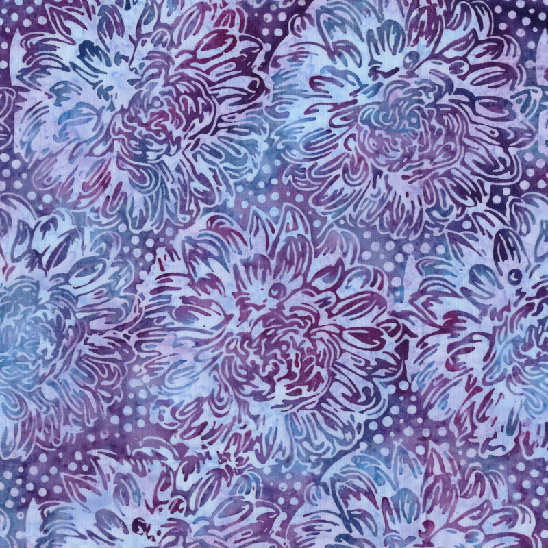 A mottled pastel blue and purple batik fabric with large dahlias. 