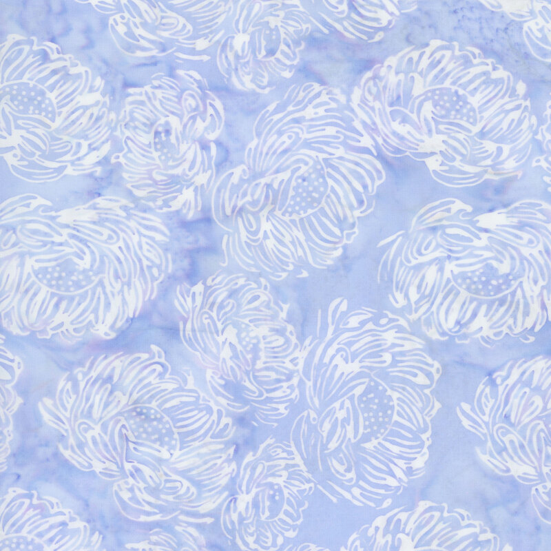 A periwinkle blue batik fabric with white flowers. 