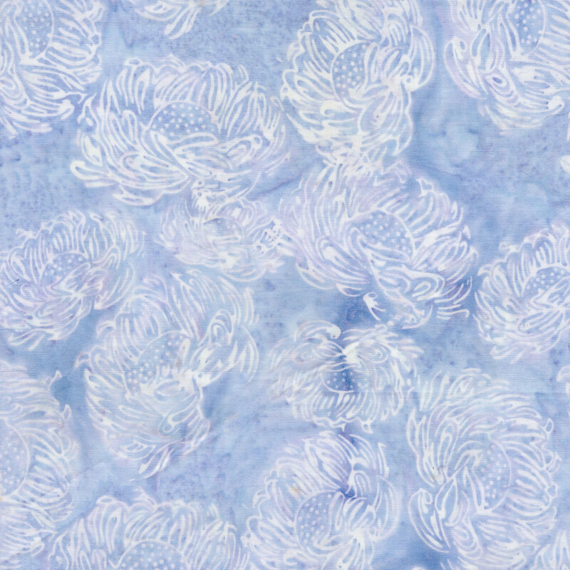 A periwinkle blue batik fabric with white flowers. 