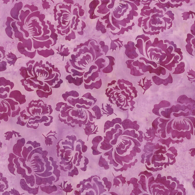 A mottled mauve pink batik fabric with orchid hollyhock flowers. 