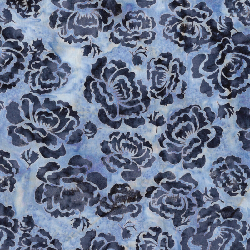 A mottled powder blue batik fabric with steel blue hollyhock flowers. 