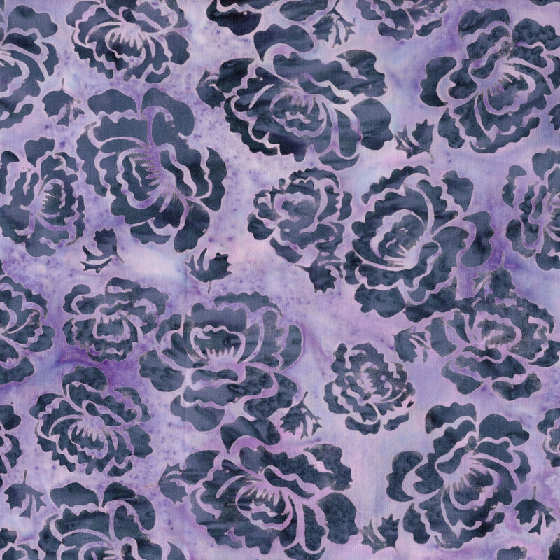 A mottled heather purple batik fabric with dark slate blue hollyhock flowers. 