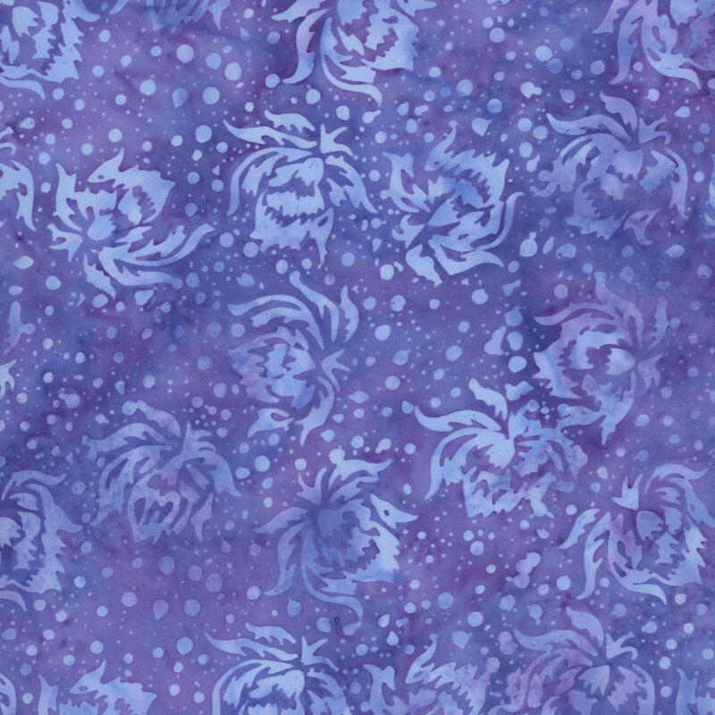 This mottled dark periwinkle batik fabric features tonal flowers and dots.