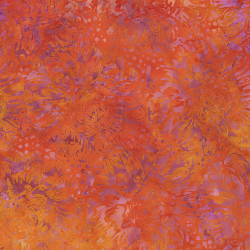 A grapefruit red, lavender, and light orange batik with dahlias. 