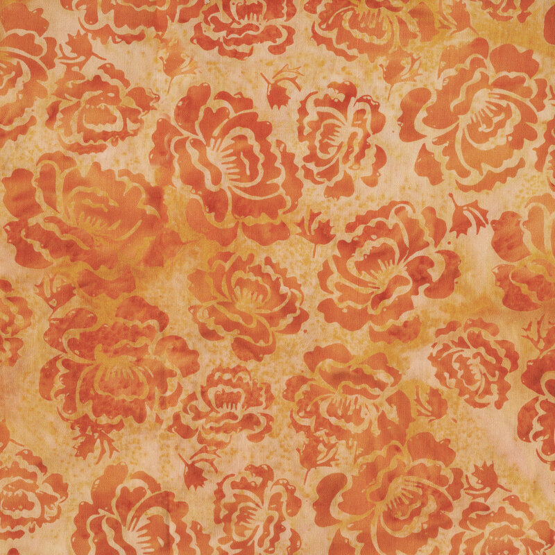 A light orange batik with pumpkin orange hollyhock florals. 