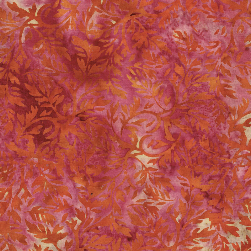A dark pink batik with copper orange leaves. 