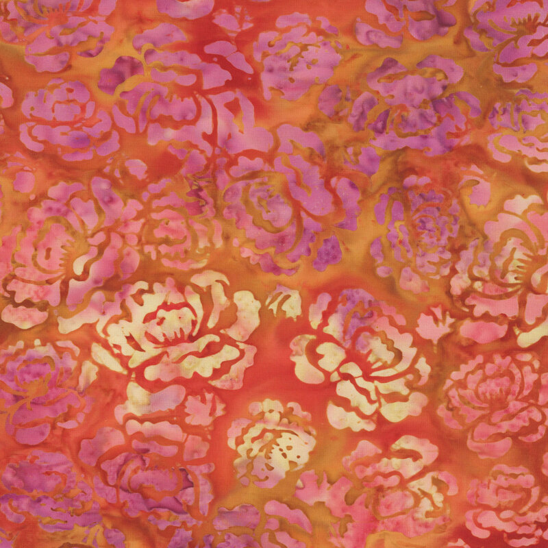 A rusty orange batik with dark pink hollyhock florals. 