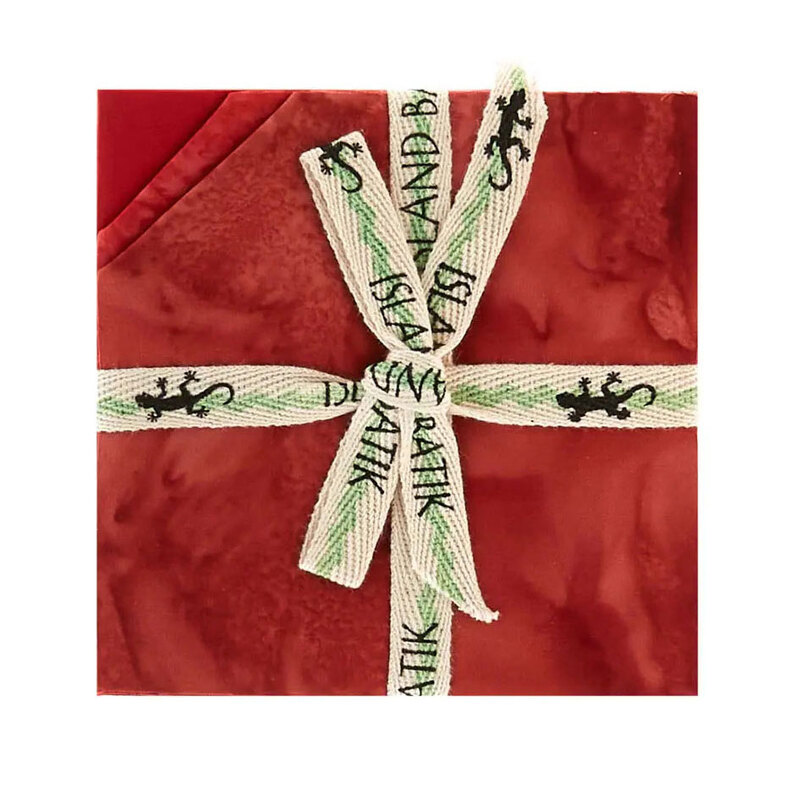 Image of the mottled red 5" charm stack with tied with an "Island Batik" ribbon.