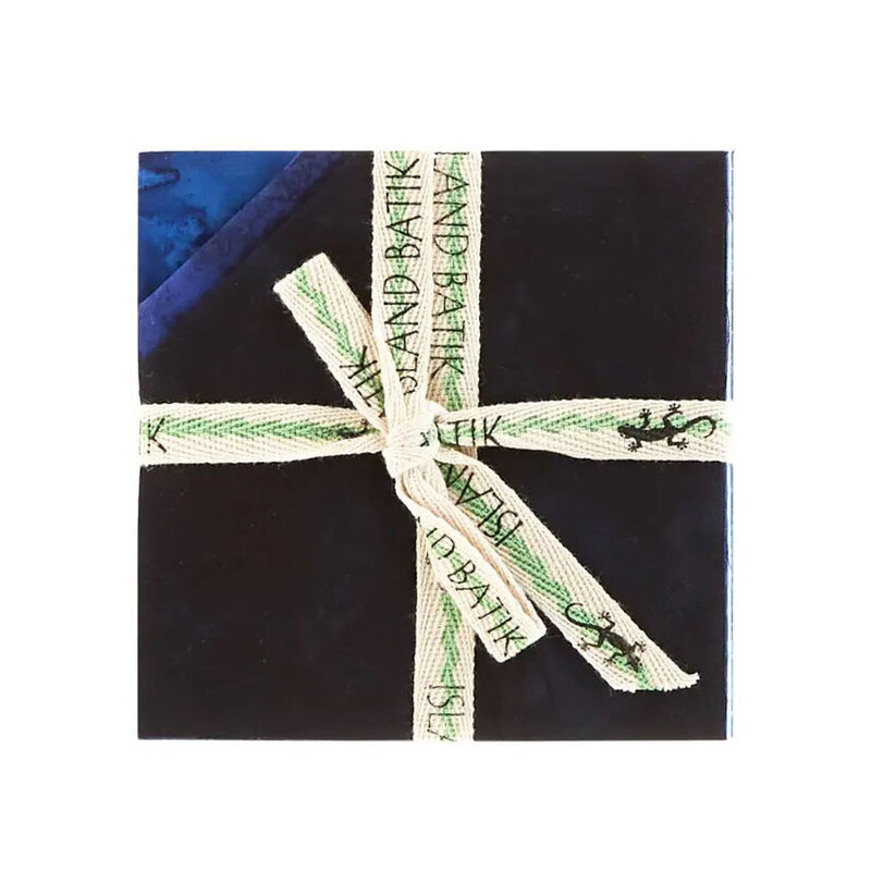 Image of the mottled blue 5" charm stack with tied with an "Island Batik" ribbon.