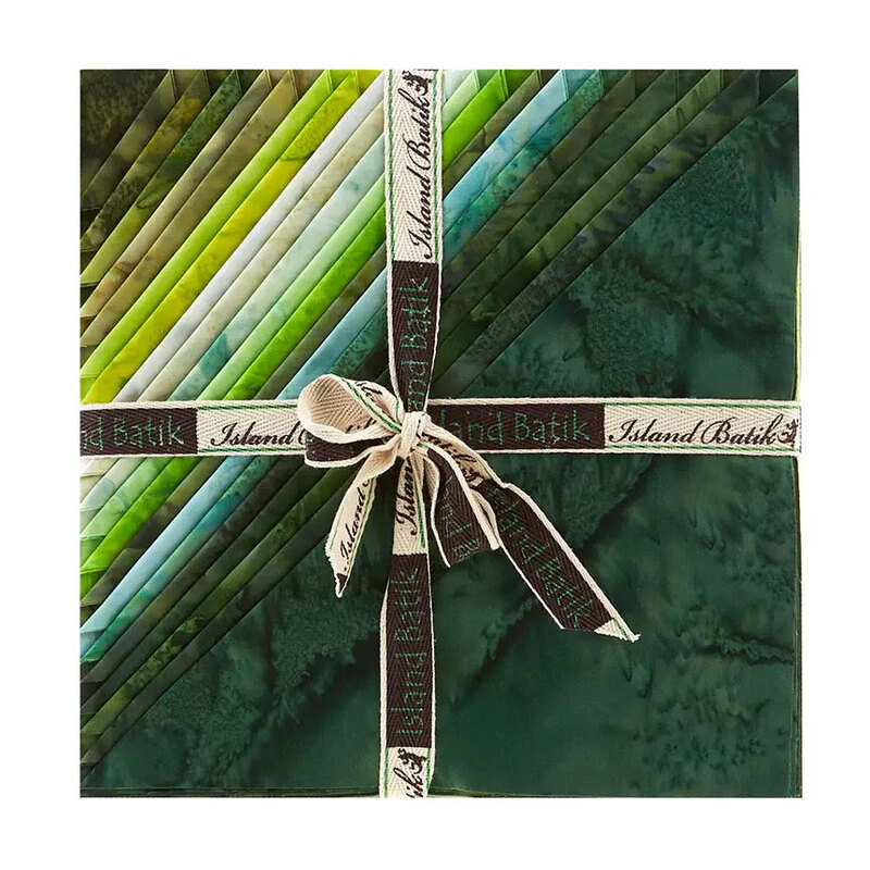 Layered stack of green mottled fabrics with the left corners folded, tied in an “Island Batik” ribbon.