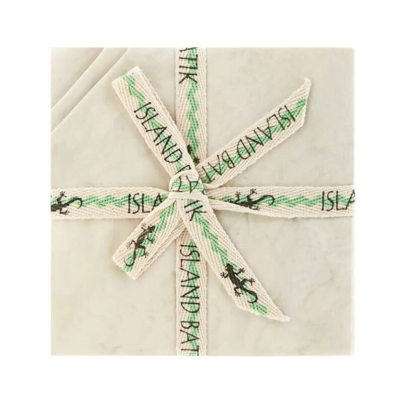 Image of the mottled ivory 5" charm stack with tied with an "Island Batik" ribbon.