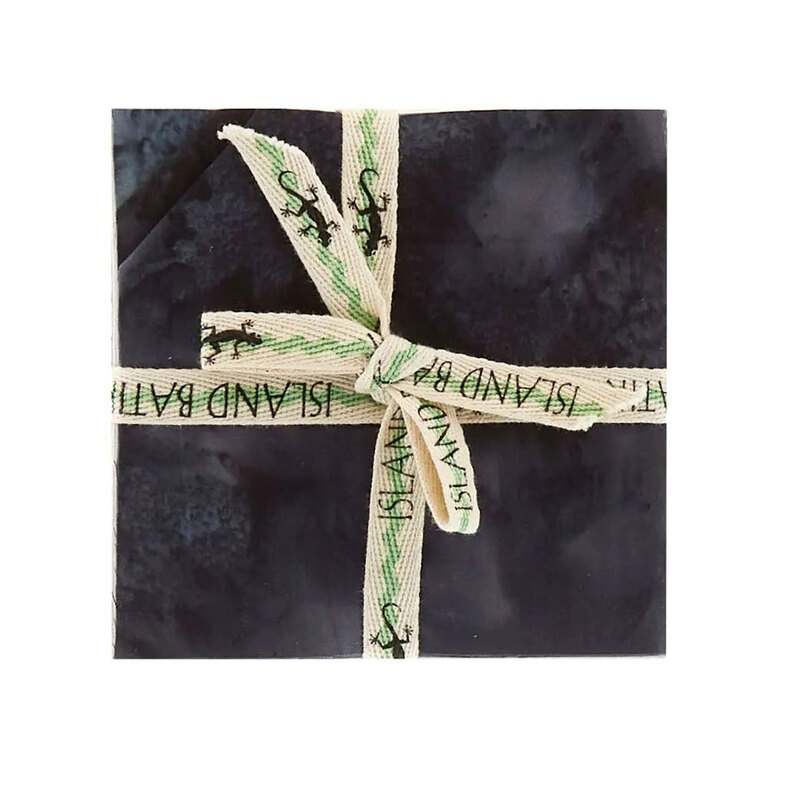 Image of the mottled black 5" charm stack with tied with an "Island Batik" ribbon.