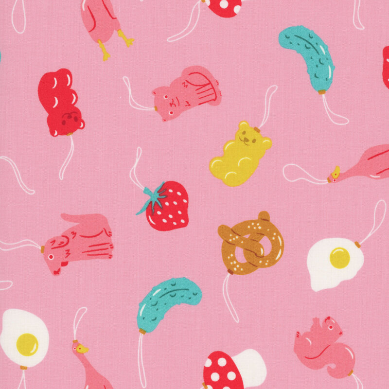 Light pink fabric featuring a tossed pattern of animal and food themed ornaments.