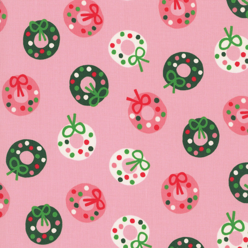 Light pink fabric featuring stylized wreath pattern in shades of green, white, and dark blush.