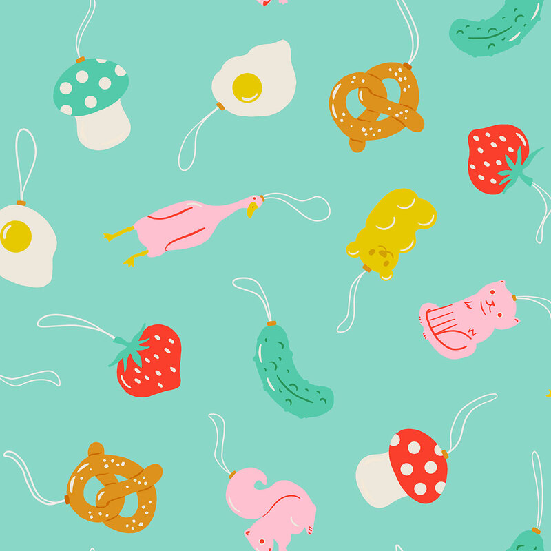 Aqua fabric featuring a tossed pattern of animal and food themed ornaments.