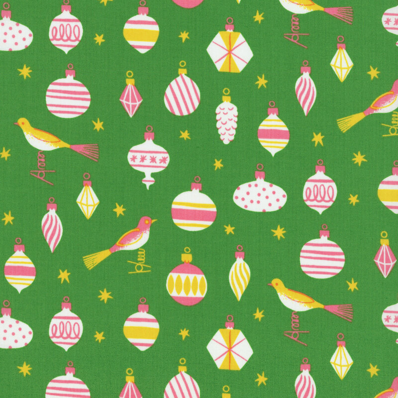 Shamrock green fabric featuring vintage style ornaments, birds, and stars in hues of pink, yellow and white.