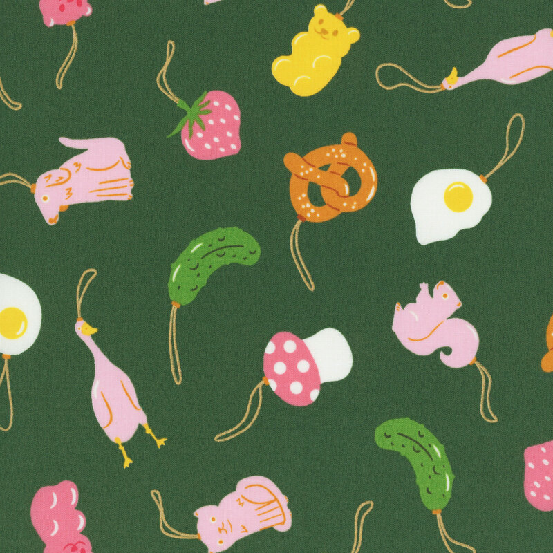 Forest green fabric featuring a tossed pattern of animal and food themed ornaments with metallic accents.