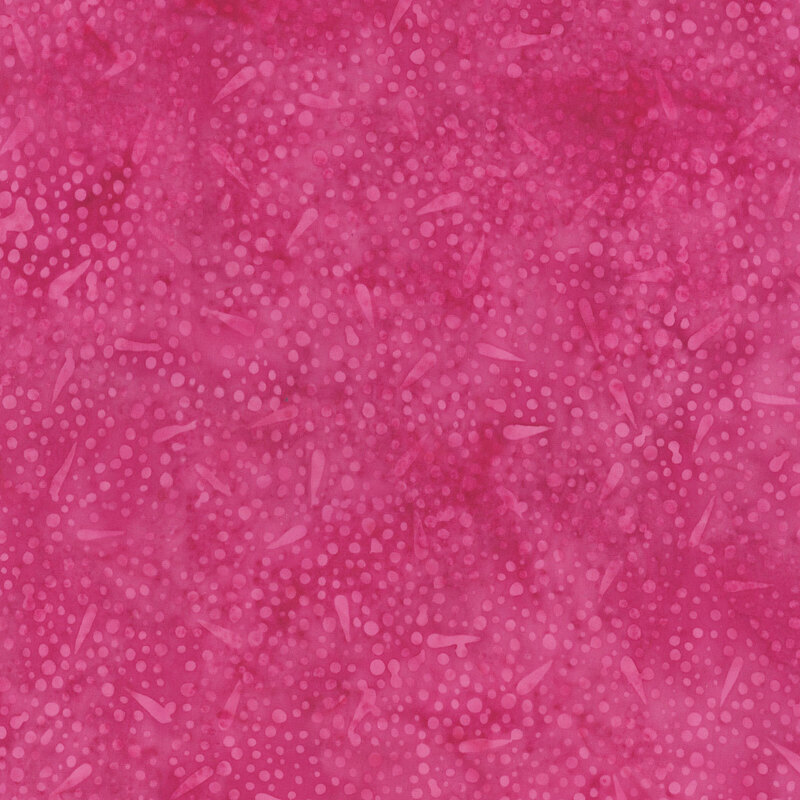 Mottled pink fabric with a blend of tonal, abstract dots and shapes.